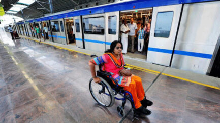 A woman wheelchair user at a Delhi Metro station.