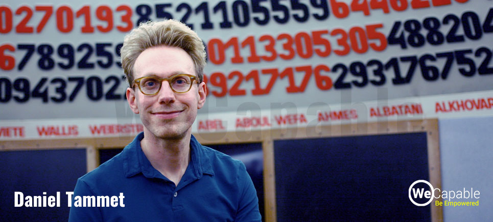 daniel tammet in front of a banner showing digits of pi