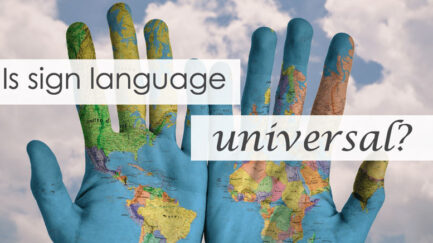 Image shows world map painted on two hands and text as "is international sign language universal?"