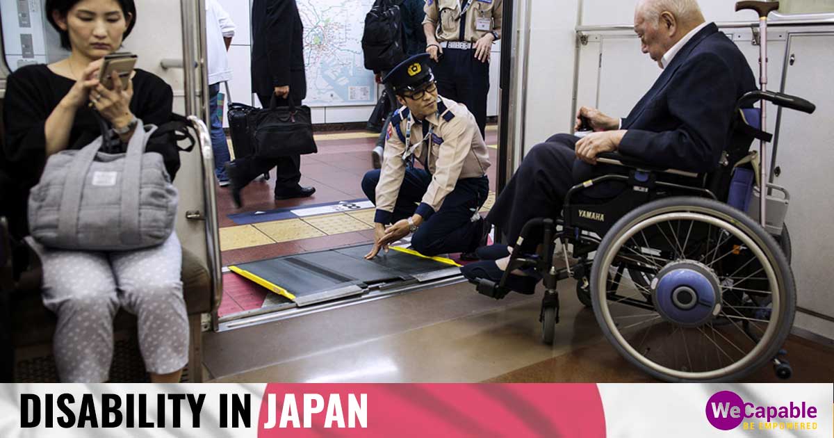 a person in wheelchair getting off a train in Japan as a railway employee sets up ramp for him.