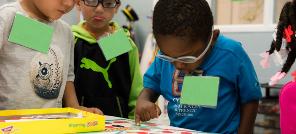 a few children with visual impairment participating in an educative activity