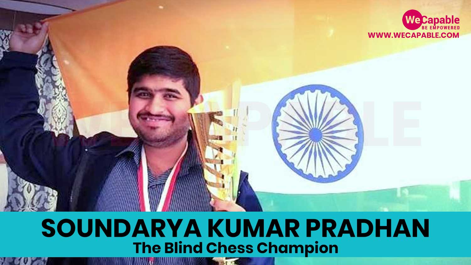 Photograph of soundarya kumar pradhan. He is holding a chess trophy and the Indian flag in background.