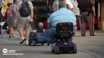 an obese man in a power wheelchair.