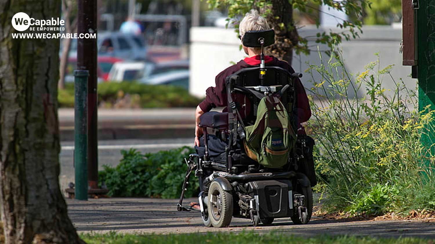 A power wheelchair user on road.