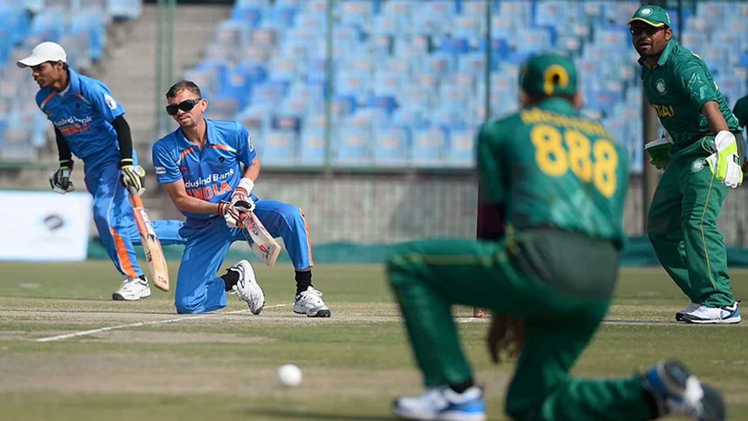 There are many differences between blind cricket and standard cricket. The image shows a blind cricket match going on between India and Pakistan.
