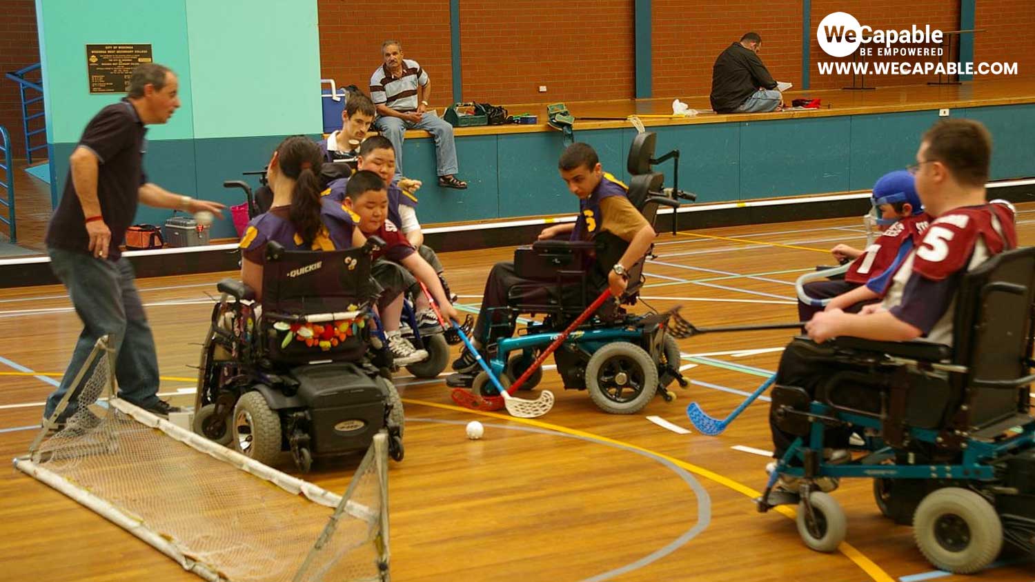 a power hockey or wheelchair hockey match is going on