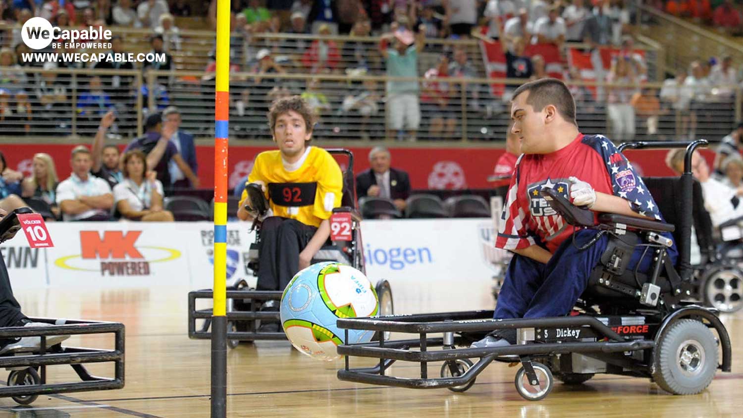 a power soccer or wheelchair football match underway