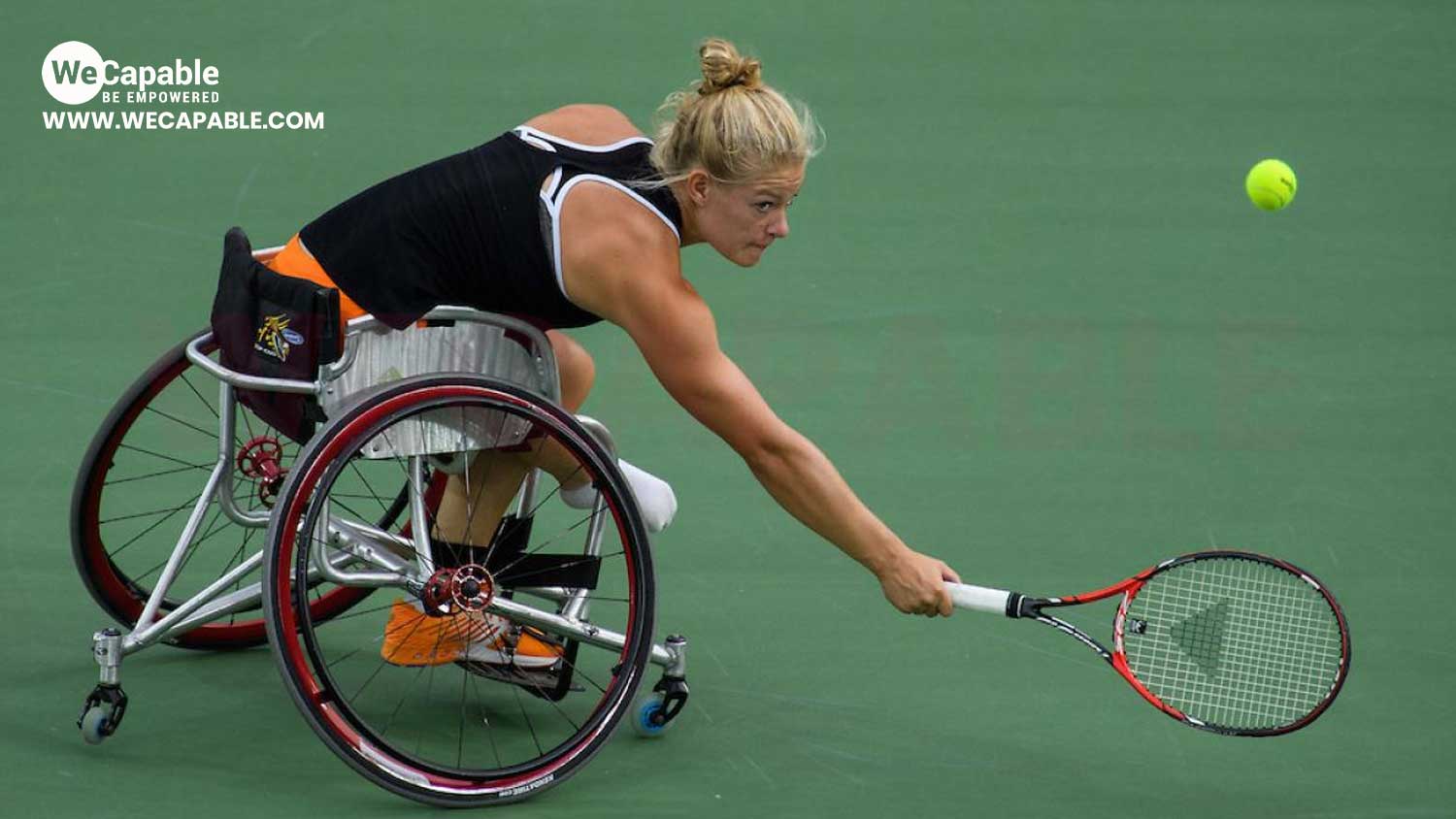 a woman playing wheelchair tennis
